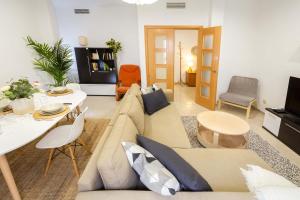 a living room with a couch and a table at Villa Viana in Rute