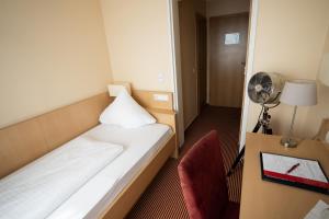 Postel nebo postele na pokoji v ubytování Europa Kehl Hotel