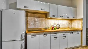 Kuchyňa alebo kuchynka v ubytovaní Apartament Angelika B1 - 5D Apartamenty