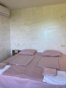 A bed or beds in a room at Kokhta guest house On the mountain