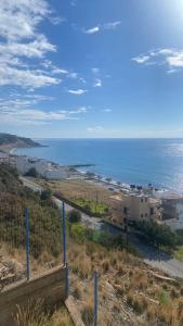 a view of a beach and the ocean at Minoan house in Tsoutsouros