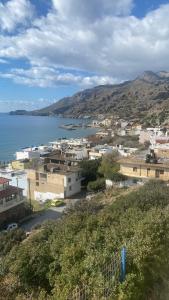 a view of a town with a body of water at Minoan house in Tsoutsouros
