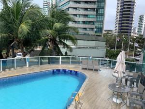The swimming pool at or close to Flat Hotel à Beira Mar Recife by Direct