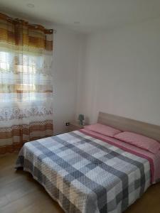 Een bed of bedden in een kamer bij Casa Vacanze da Peppe