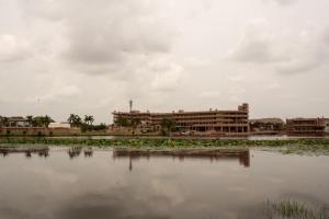 a large building next to a body of water at Lake View Hotel and Resort in Jodhpur