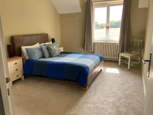 A bed or beds in a room at Lac De Lumiere. Relax with rural lakeside living