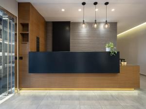 a reception desk in a lobby with lights at Nontas suites in Kato Daratso +63 photos