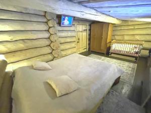 Letto o letti in una camera di Forest hut Stariy Prud