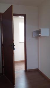 an open door to a room with a door at Star Hotel 209 in Juiz de Fora