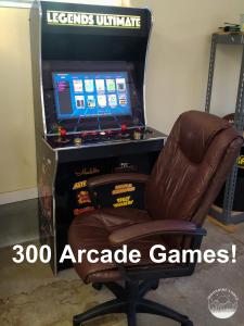a brown chair sitting in front of a arcade game at Moonrise Lodge - A Large Vacation Home in Mariposa in Mariposa