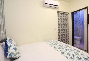 Postel nebo postele na pokoji v ubytování Lucky Star Homestay