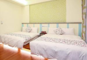 Postel nebo postele na pokoji v ubytování Lucky Star Homestay