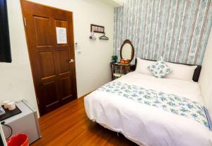 Postel nebo postele na pokoji v ubytování Lucky Star Homestay
