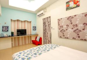 TV a/nebo společenská místnost v ubytování Lucky Star Homestay