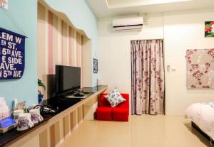 TV a/nebo společenská místnost v ubytování Lucky Star Homestay
