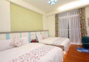 Postel nebo postele na pokoji v ubytování Lucky Star Homestay