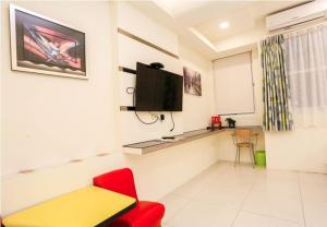 TV a/nebo společenská místnost v ubytování Lucky Star Homestay