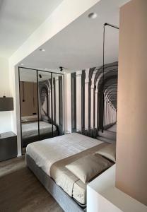 a bedroom with a large bed in a building at Alfea Suite in Bologna