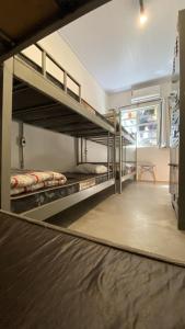 a bunk bed room with two bunk beds in it at Imagina Hostel in Sao Paulo
