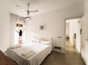מיטה או מיטות בחדר ב-Villa delle Palme