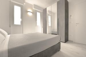 Ein Bett oder Betten in einem Zimmer der Unterkunft Milleventi Apartments Bologna