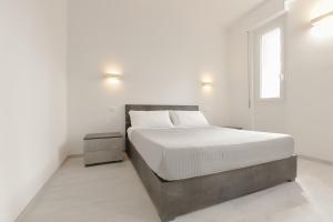 Ein Bett oder Betten in einem Zimmer der Unterkunft Milleventi Apartments Bologna