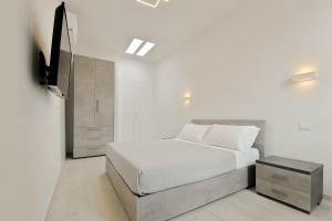 Ein Bett oder Betten in einem Zimmer der Unterkunft Milleventi Apartments Bologna