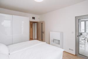 Posteľ alebo postele v izbe v ubytovaní Garden Towers