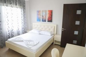 Postel nebo postele na pokoji v ubytování Luis Penthouse