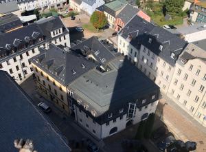 an overhead view of a building with a black roof at Kerkermeister Pension in Auerbach