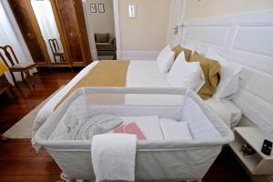 Ένα ή περισσότερα κρεβάτια σε δωμάτιο στο Casa Côrte Real +33 φωτογραφίες