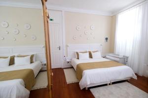Postel nebo postele na pokoji v ubytování Casa Côrte Real