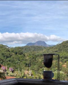 a room with a view of a mountain at Chalé Vista Azul in Domingos Martins