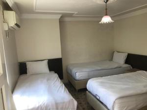 Postel nebo postele na pokoji v ubytování KARADUT PENSION NEMRUT + 13 fotografií
