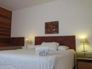 Ένα ή περισσότερα κρεβάτια σε δωμάτιο στο Pousada La Vivienda +13 φωτογραφίες