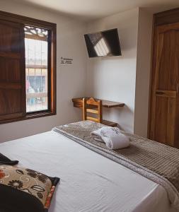 Postel nebo postele na pokoji v ubytování Famy Hostal Nardo's