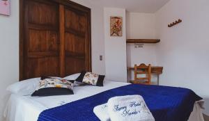 Postel nebo postele na pokoji v ubytování Famy Hostal Nardo's