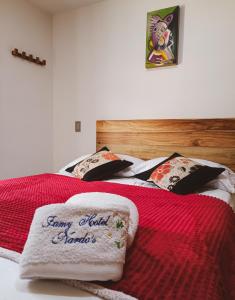 Postel nebo postele na pokoji v ubytování Famy Hostal Nardo's