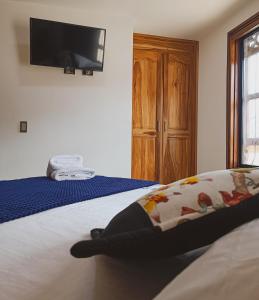 Postel nebo postele na pokoji v ubytování Famy Hostal Nardo's