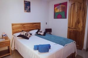 Postel nebo postele na pokoji v ubytování Famy Hostal Nardo's