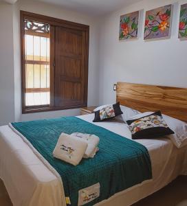 Postel nebo postele na pokoji v ubytování Famy Hostal Nardo's