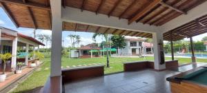 an outdoor patio with a pool table in a house at Hotel Chalet La Sofia by Majuva in Armenia