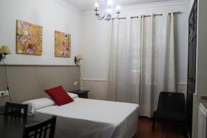 Cama o camas de una habitación en Apartamentos Turisticos Casa Cantillo
