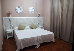 Cama o camas de una habitación en Apartamentos Turisticos Casa Cantillo