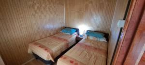 Voodi või voodid majutusasutuse Cabañas camelia2 toas