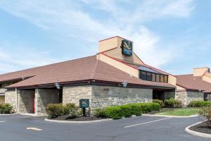 a building with a sign on the side of it at Quality Inn Columbus-East in Columbus