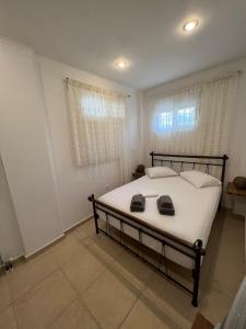 Postel nebo postele na pokoji v ubytování Selinia Villa Nikos Gianna