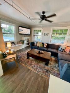 a living room with a couch and a table at The Clinkscale in Jerome