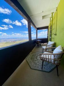a room with two chairs and a view of the ocean at The Clinkscale in Jerome