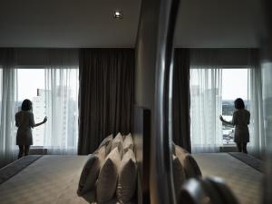 Krevet ili kreveti u jedinici u okviru objekta Pullman Kuching